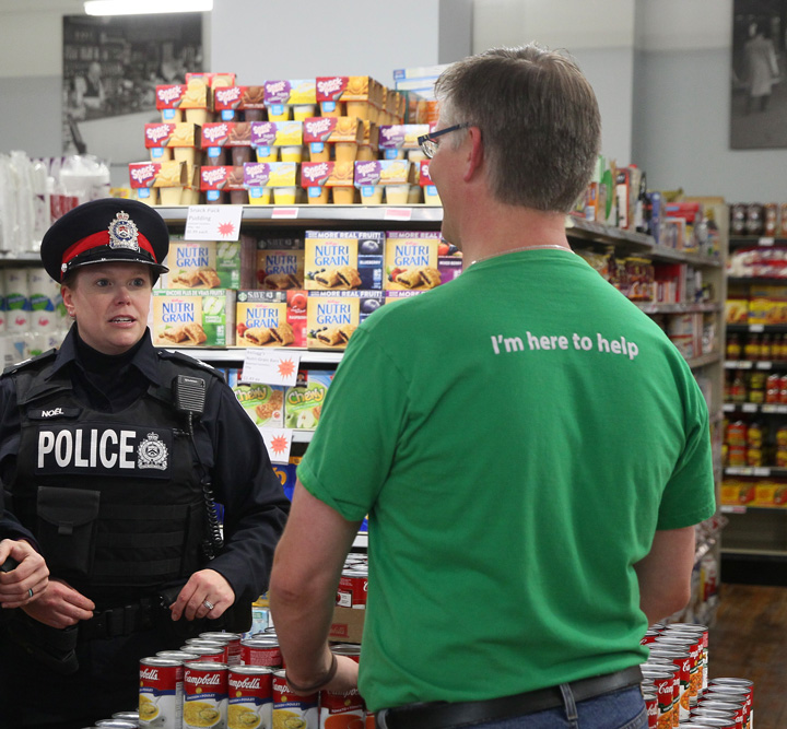 London City Police  Sergeant talking to shop clerk