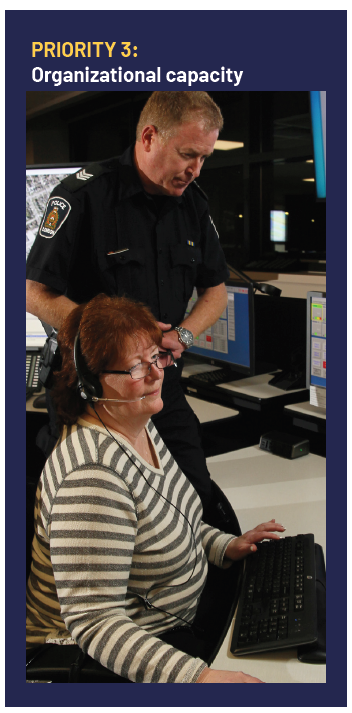 Image of Communication Sergeant and dispatcher looking at computer