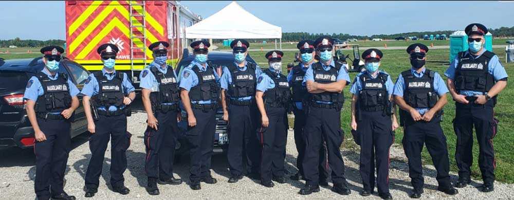 Group of Auxiliary officers posing in line for photo
