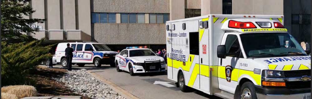 Ambulance and Police Cars in line at hospital