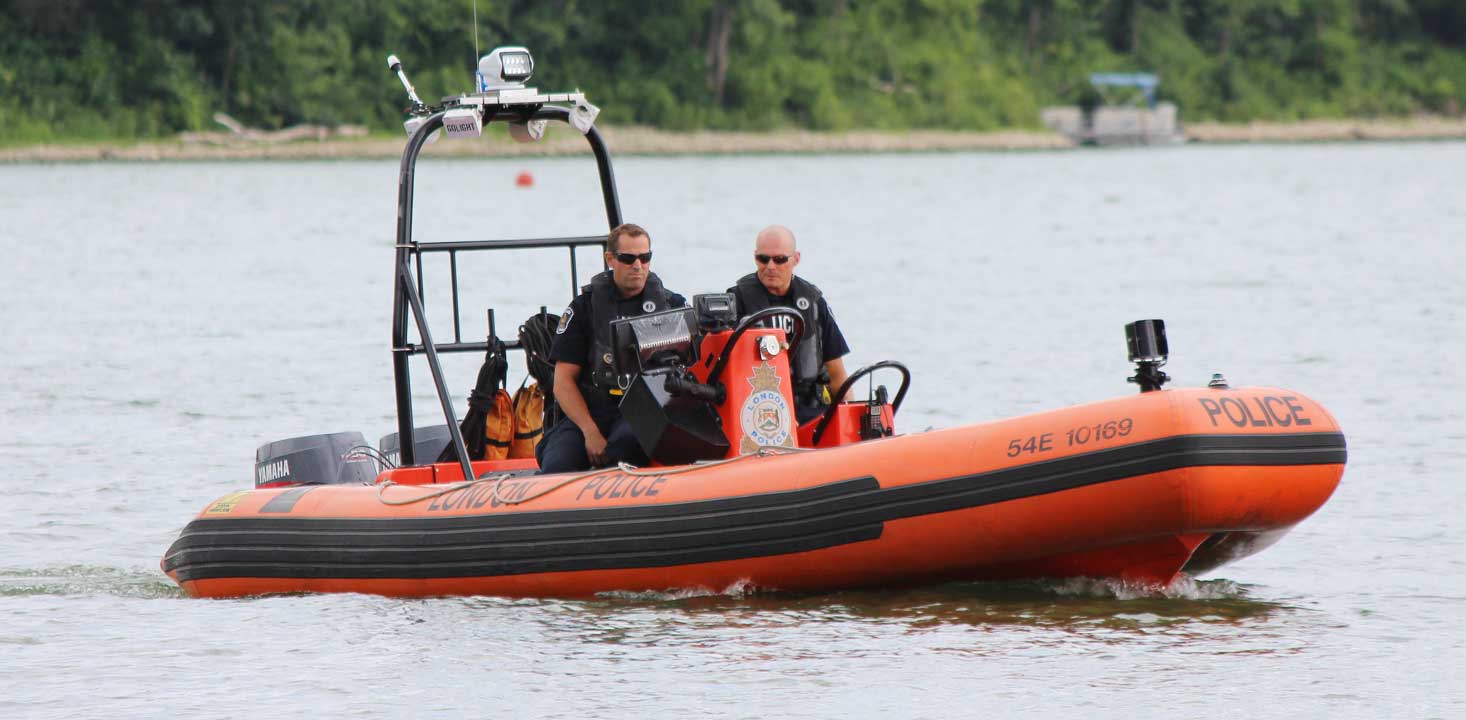 LPS boat (orange and black) with 2 officers on lake