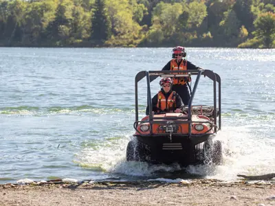 LPS officer driving amphibious vehicle out of lake