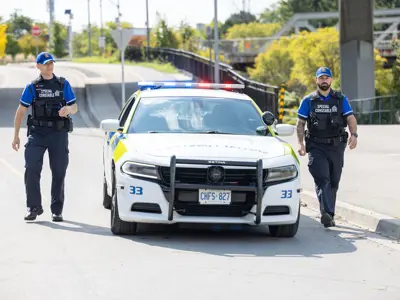 Two LPS Special Constables, one on each side of Special Constable Cruiser