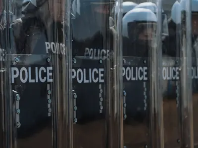 Public Order Unit Training - standing behind clear shields, officers in tight formation