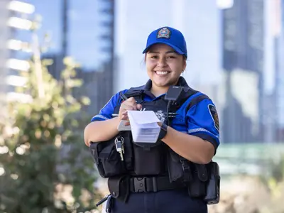 Female Special Constable writing in her notebook
