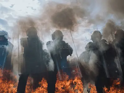 Public Order Unit Training - fire on ground, cloudy sky
