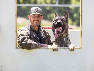 LPS officer and K9 on K9 obstacle course