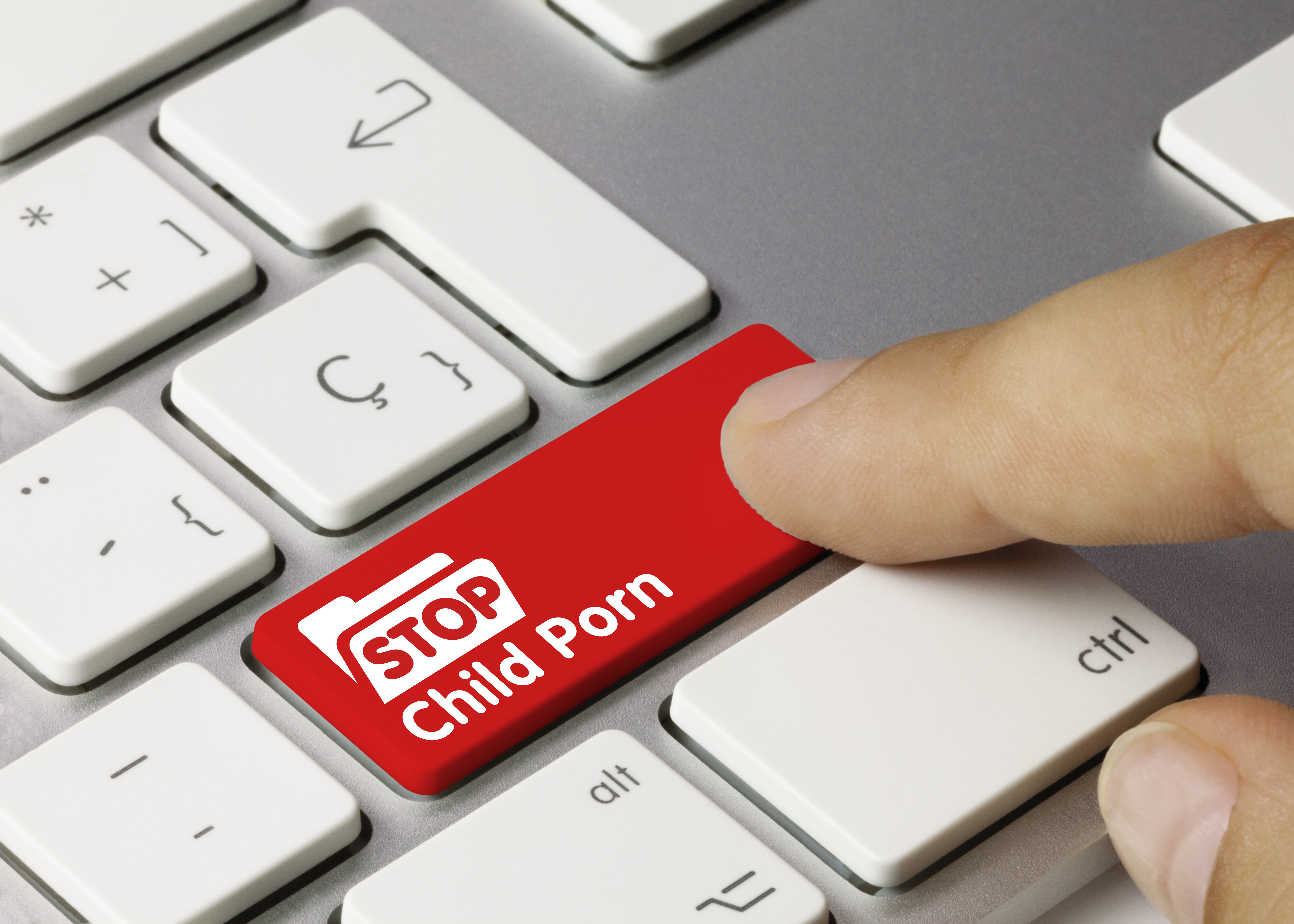 keyboard with a red key that reads "stop child porn"