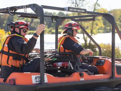 2 LPS officer driving amphibious vehicle