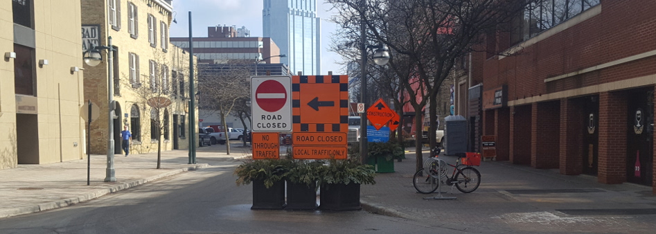 street with road closed and detour signs