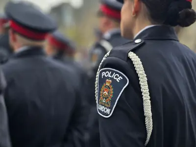 Female LPS member standing at attention, back and top of head image