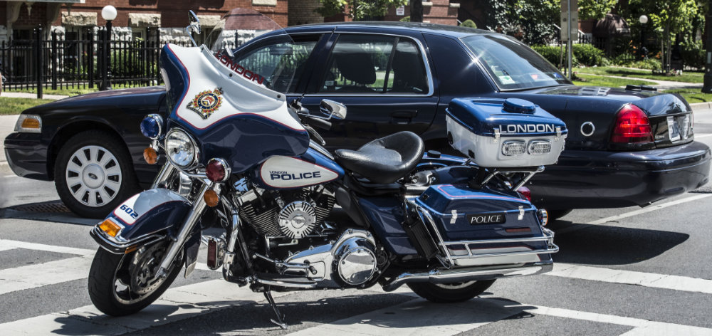Police traffic unmarked cruiser and LPS Harley Motorcycle