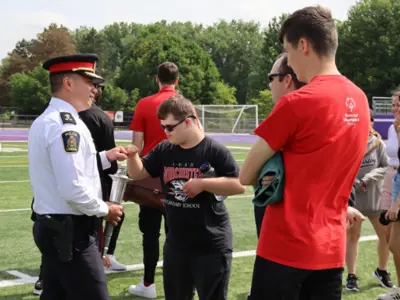 Chief Truong at Special Olympic Games, participants in background