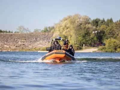 LPS Marine Unit boat riding across lake
